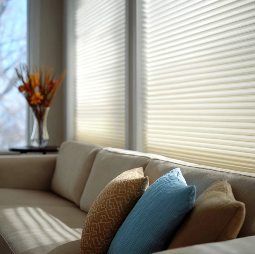 Close-up of cellular shades filtering soft morning light in a Fullerton, CA living room. 