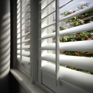 Plantation shutters with angled louvers controlling natural light in a Fullerton, CA home. 