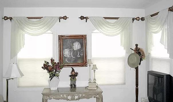 Living room windows with soft valances and light-filtering shades, showcasing custom window blinds, shades, and shutters Fullerton, CA homeowners choose for elegance and privacy.
