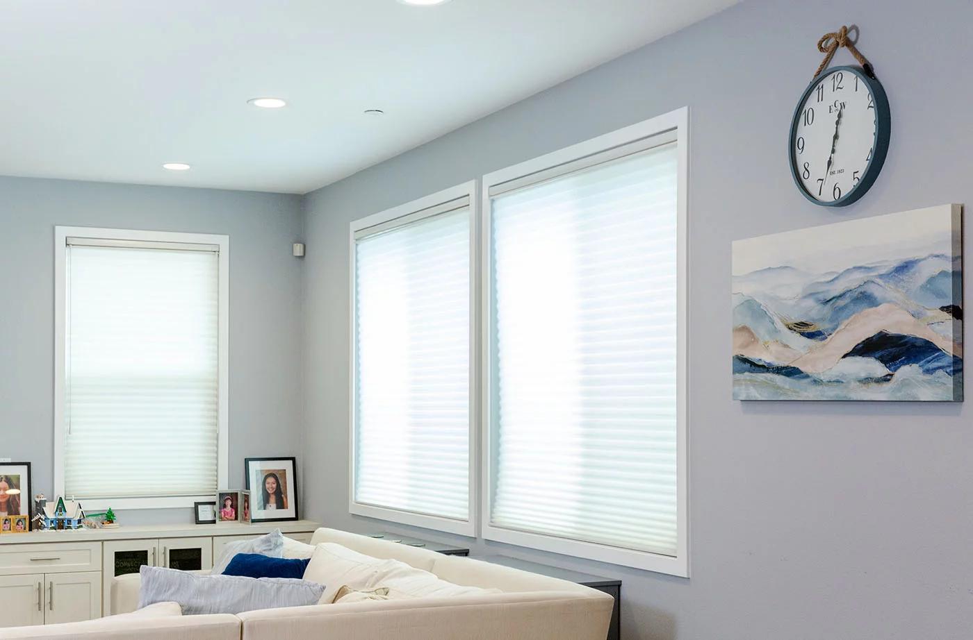 Living room with light-filtering shades, featuring window blinds, shades, and shutters Yorba Linda, CA for privacy and style.